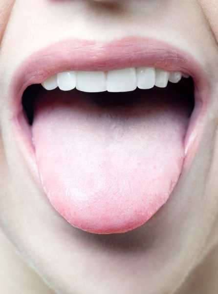 Woman&apos;s tongue mouth open