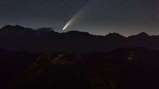 Comet NEOWISE seen in the night sky at Jaufenpass in South Tyrol, Itlay.