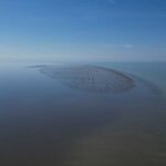 Russian scientists have discovered a new island in the Caspian Sea, the world's largest inland body of water.
