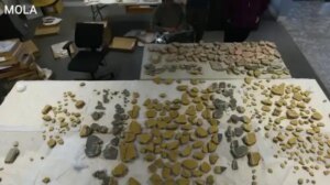 Student discovers ancient carved head at dig on Scottish island