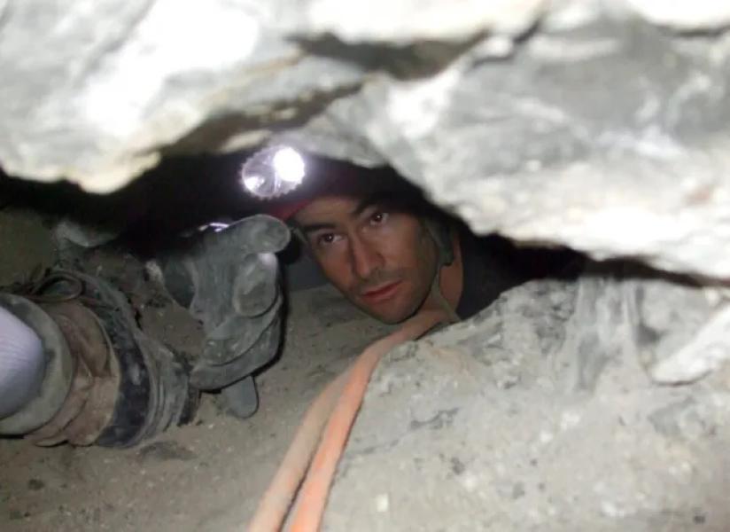 A rescuer with Utah Cave Rescue attempts to free John Jones from the depths of Nutty Putty Cave. Jones died after being trapped in the crevasse for more than 27 hours. (Photo: Utah County Sheriff's Office) Photos courtesy of the Utah County Sheriff's Office.