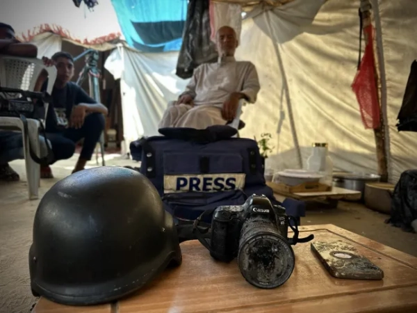KHAN YOUNIS, GAZA - AUGUST 27: The camera, journalist's vest, helmet and mobile phone of Mariam Abu Dagga, one of the five journalists killed in the Israeli army's attack on the Nasser Medical Complex in Khan Younis on August 25, during an exclusive interview in Khan Younis, Gaza, August 27, 2025. Mariam Abu Dagga, who worked as a journalist for various media outlets including Independent Arabia and AP, was one of the journalists who stayed in Gaza to bring the truth to the world. The family of Mariam, a mother of one, said their daughter was badly injured and exhausted during the attacks on Gaza. (Photo: Doaa Albaz/Anadolu via Getty Images)