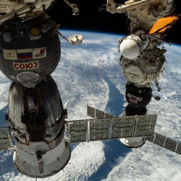 Astronaut Pettit and two cosmonauts undock from the International Space Station