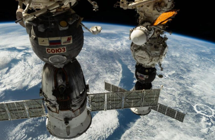 Astronaut Pettit and two cosmonauts undock from the International Space Station