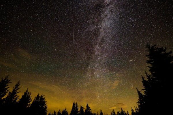In this 30 second exposure, a meteor streaks across the sky during the annual Perseid meteor shower, in 2021, in Spruce Knob, West Virginia. The Ursid meteor shower, the final celestial event of the year, will take place overnight Sunday into Monday. NASA Photo by Bill Ingalls/UPI