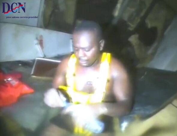 Capsized, submerged: 60 hours among deceased shipmates.