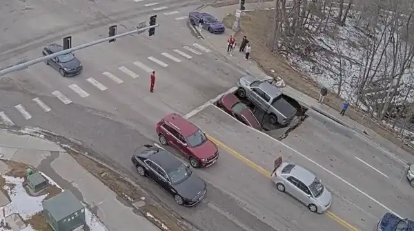 Street cave-in filmed; cars vanish near Nebraska U.