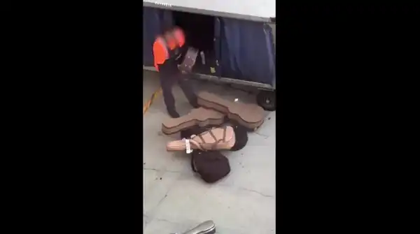 Man at LAX Airport seen tossing guitar cases onto the tarmac