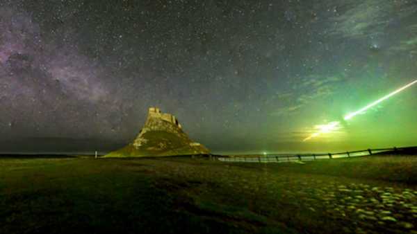 Bright green meteor seen exploding over Lindisfarne Castle, historic site of Viking&hellip;